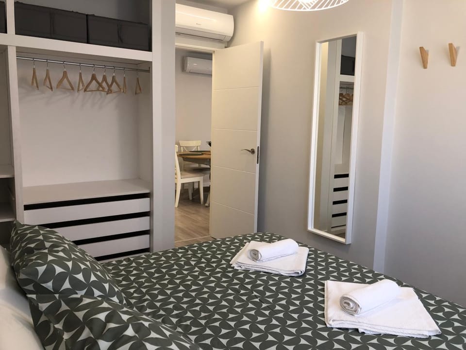 Bedroom, towels, wardrobe, air conditioner