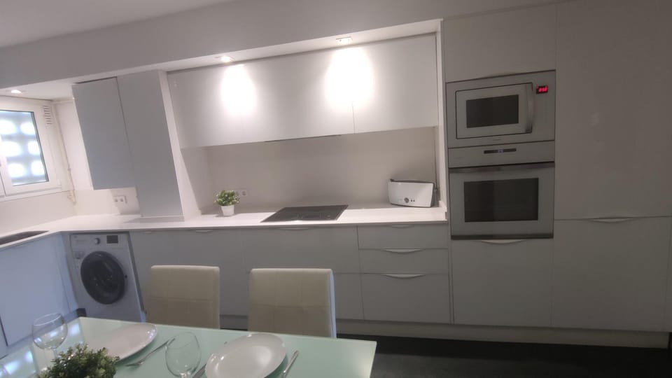Kitchen or kitchenette, oven, stove, washing machine