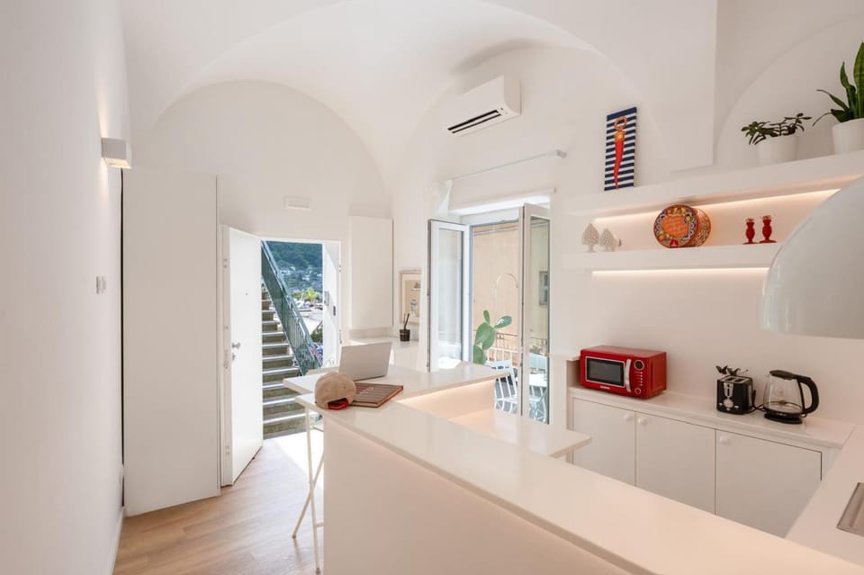 Kitchen or kitchenette, Seating area, microwave, toaster, wardrobe, washing machine, air conditioner