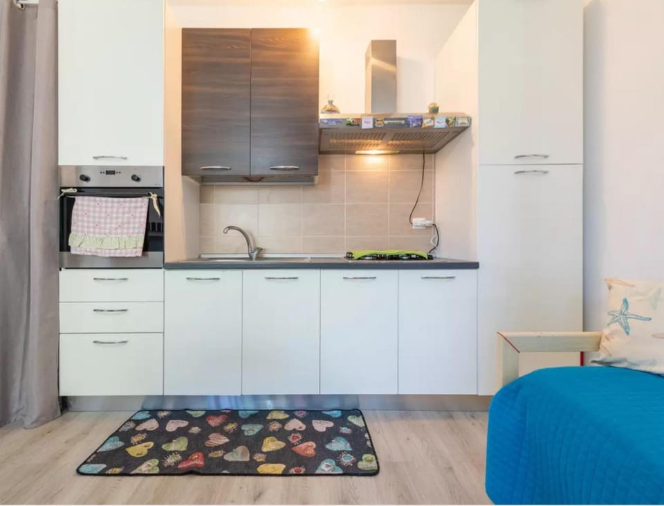 Kitchen or kitchenette, oven, stove, air conditioner