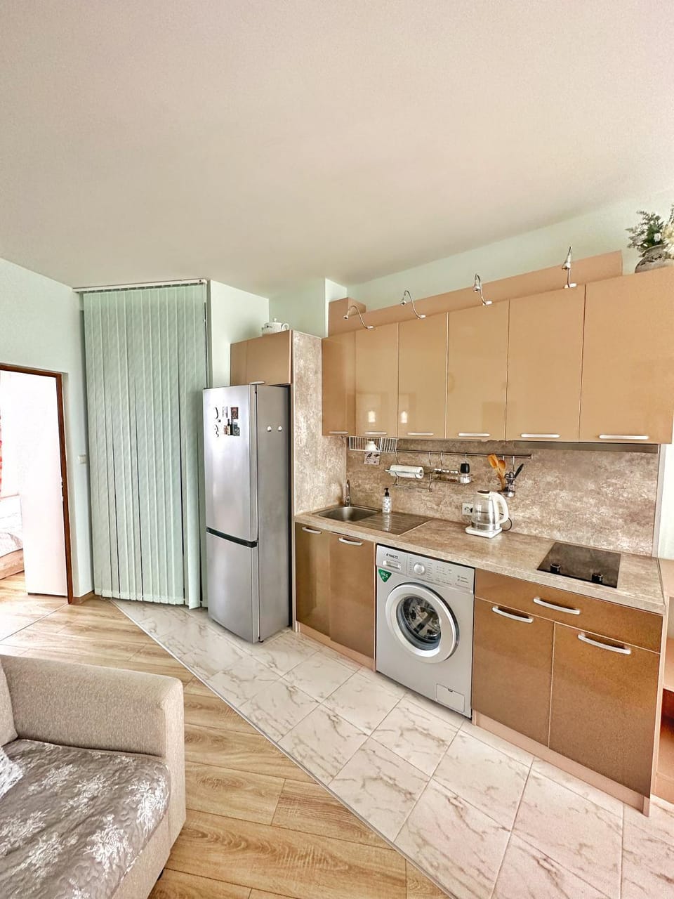 Kitchen or kitchenette, stove, toaster, washing machine