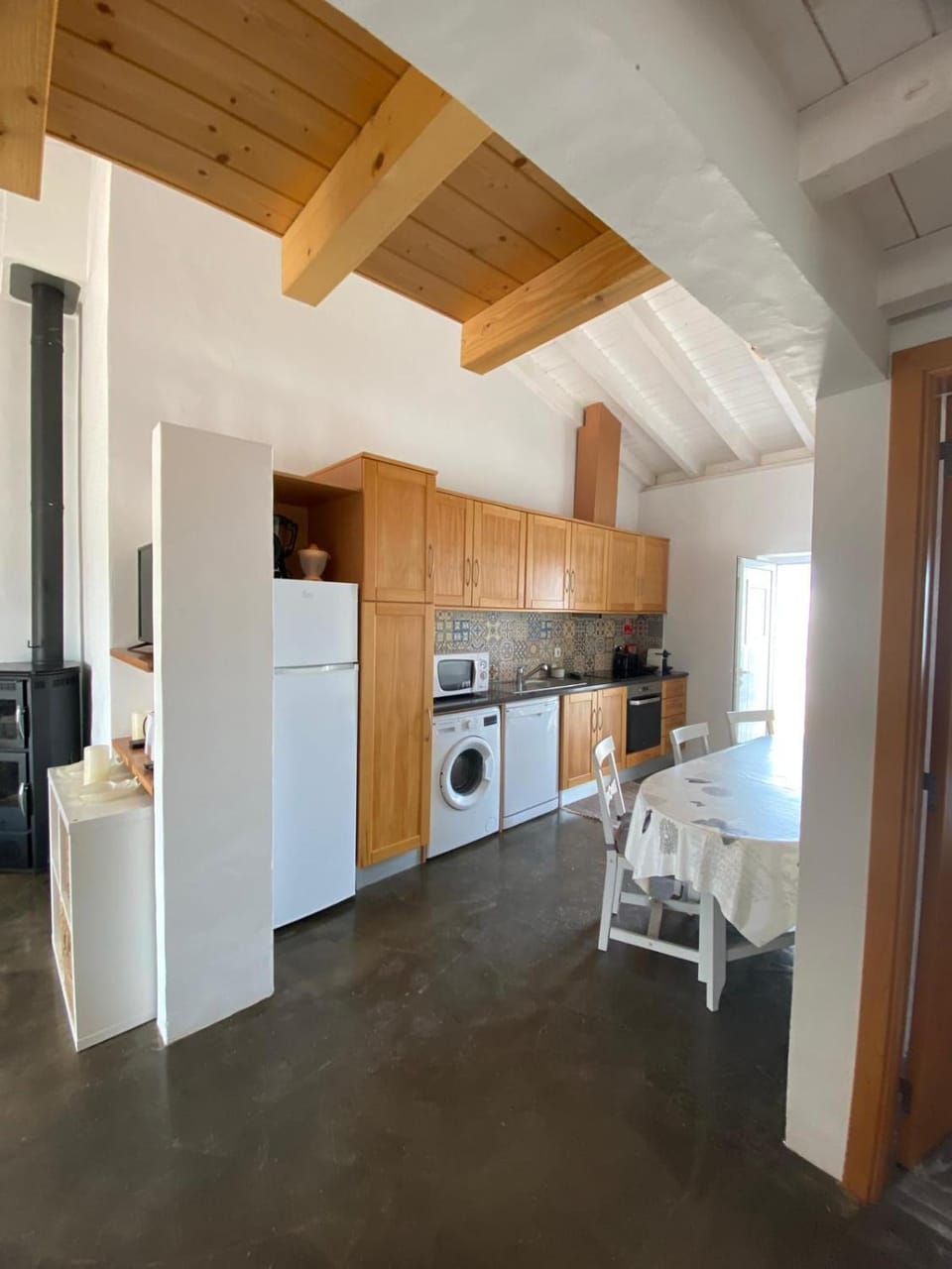 Kitchen or kitchenette, dishwasher, oven, stove