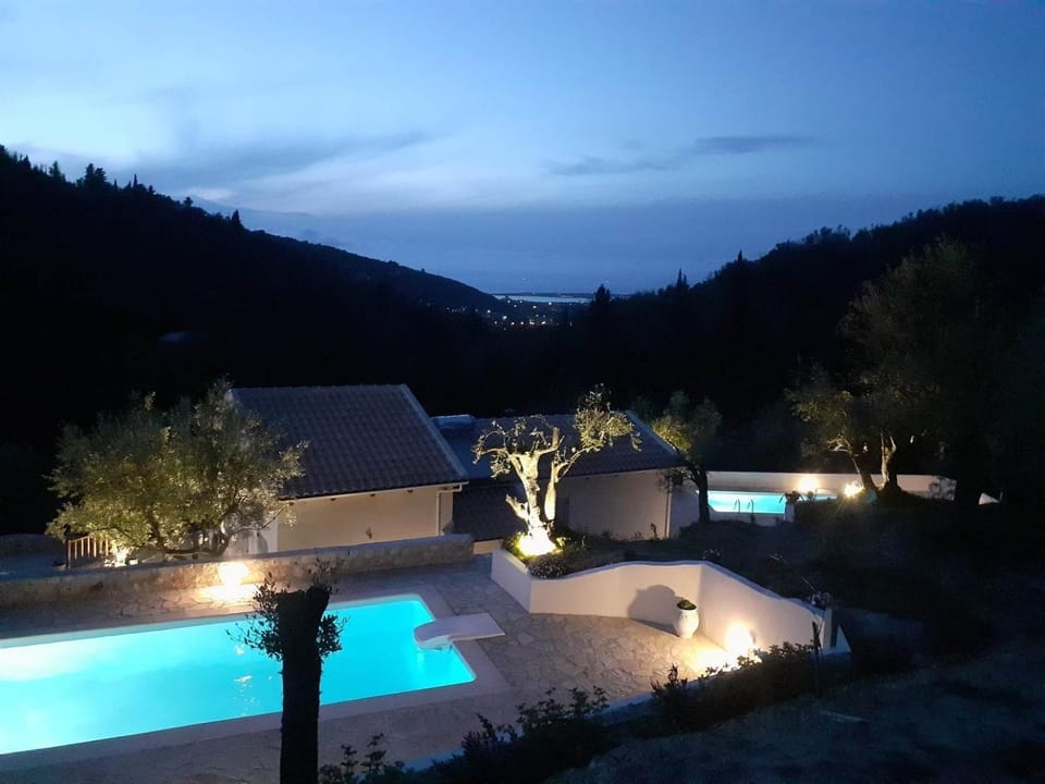 Property building, Night, Natural landscape, Mountain view, Pool view, Swimming pool, sunbed
