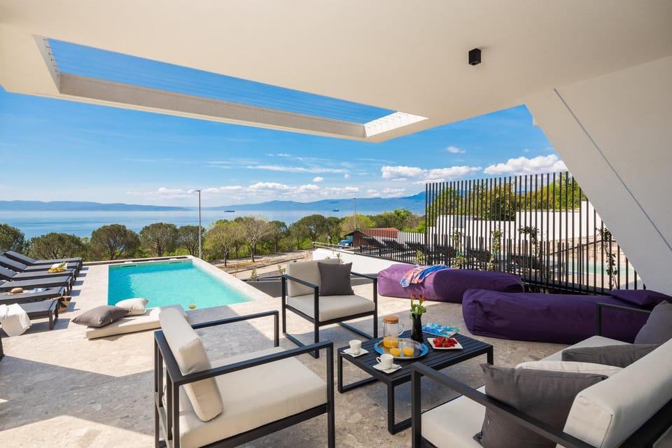 View (from property/room), Seating area, Sea view, Swimming pool