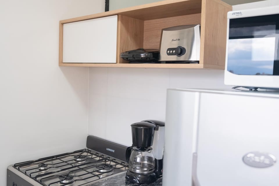 Kitchen or kitchenette, stove, toaster