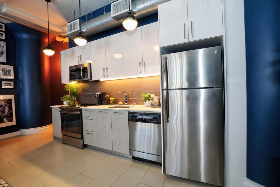Kitchen or kitchenette, dishwasher, oven, stove