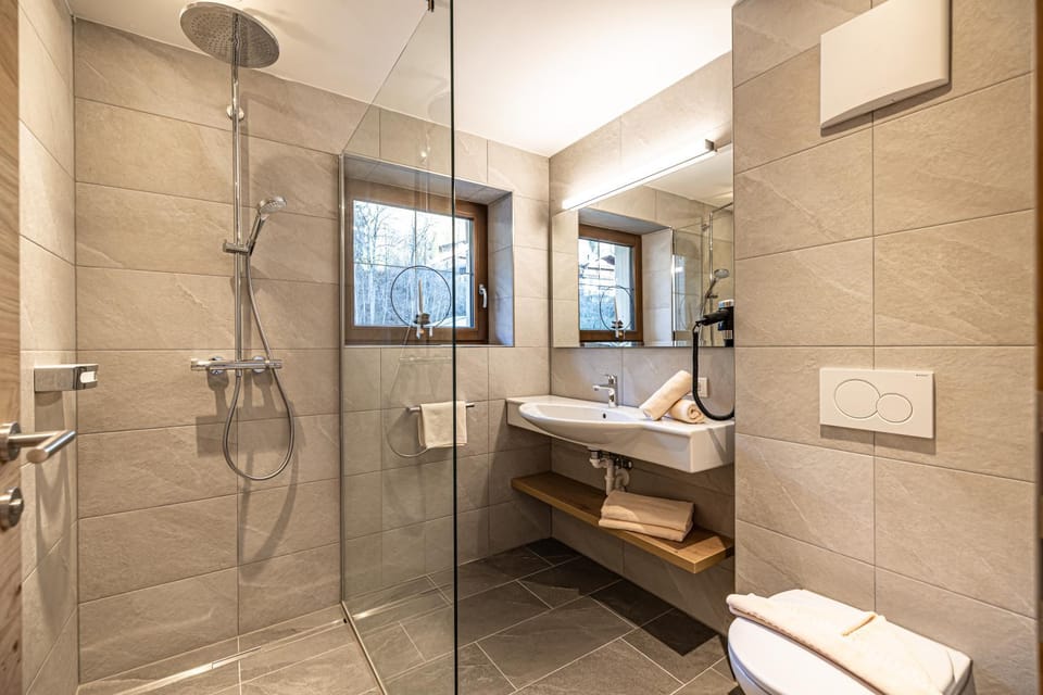 Shower, Toilet, Bathroom, hair dryier, towels