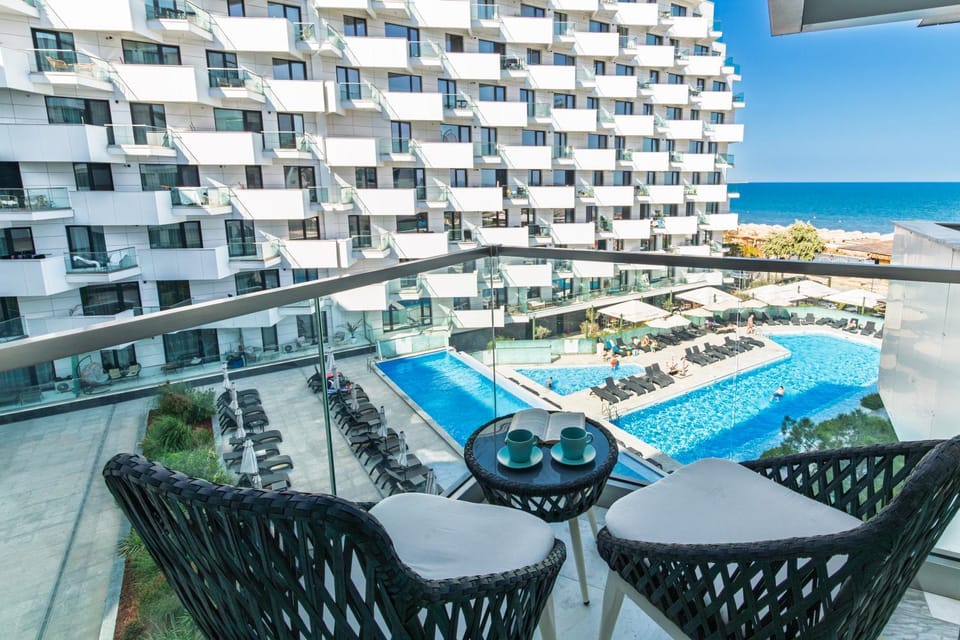 View (from property/room), Balcony/Terrace, Seating area, Pool view, Sea view, Swimming pool