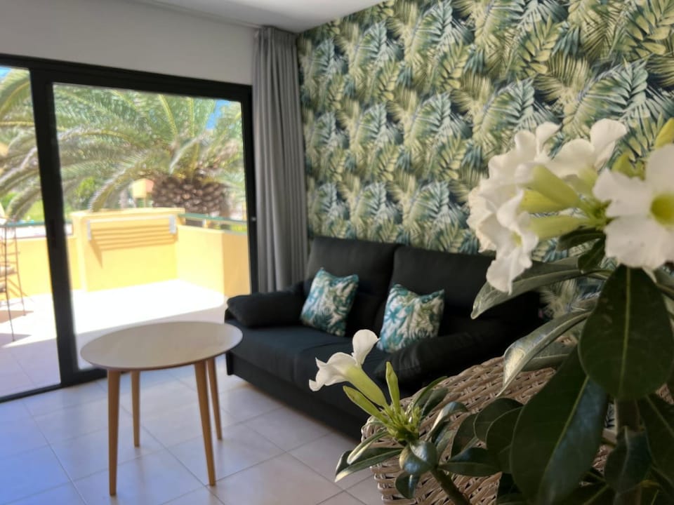 Living room, Seating area, Pool view, air conditioner
