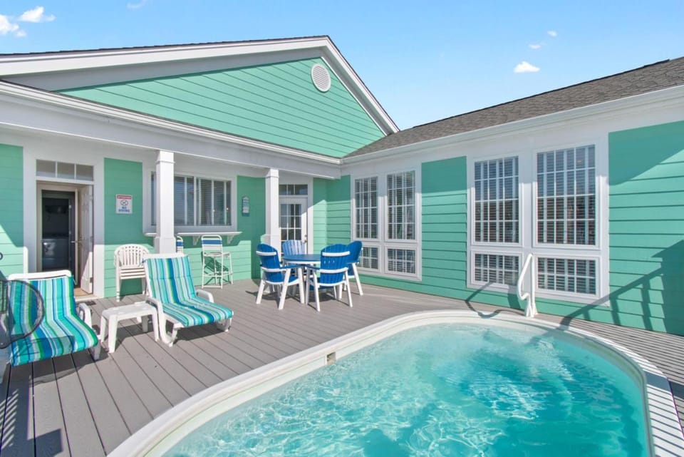 Property building, Patio, Day, Seating area, Dining area, Swimming pool