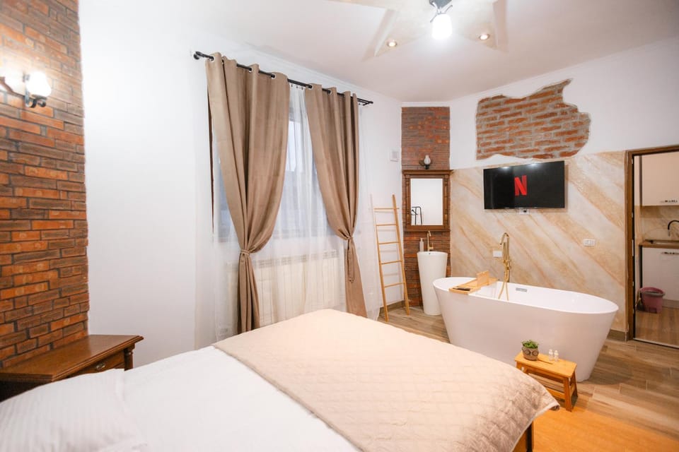 Marcos Apartments I Bathtub in Bedroom experience Apartment in Brașov County
