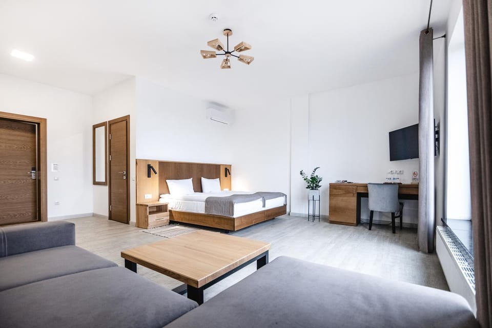 Communal lounge/ TV room, Bed, TV and multimedia, Living room, Photo of the whole room, Seating area, hair dresser, air conditioner