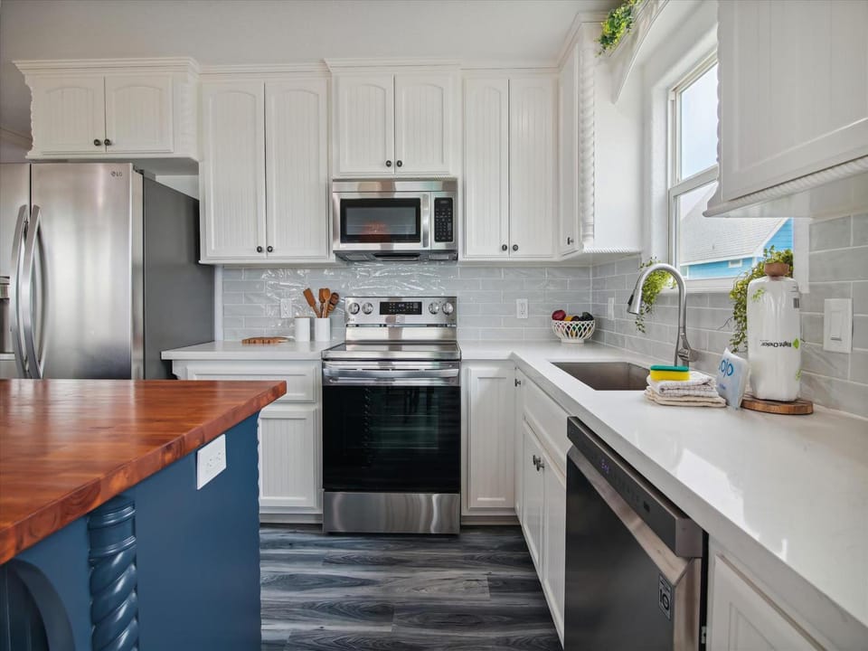 Kitchen or kitchenette, dishwasher, microwave, oven, stove, kitchen