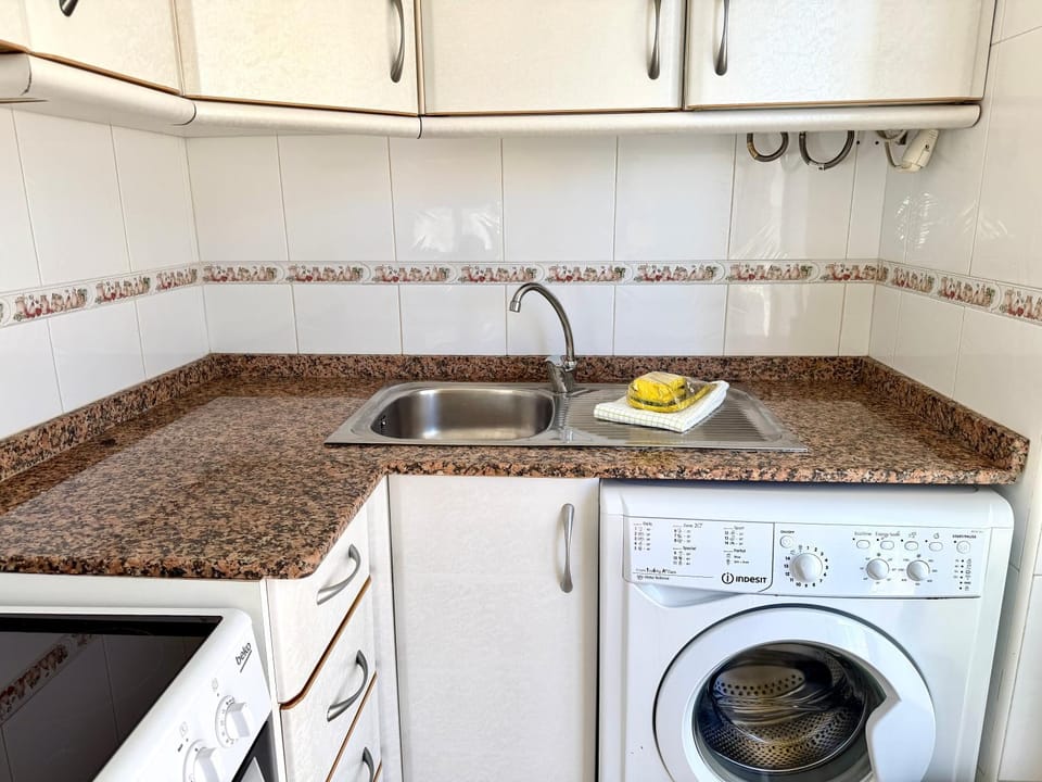 Kitchen or kitchenette, washing machine