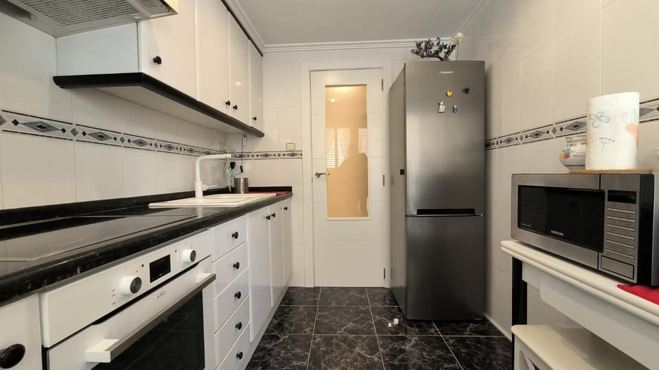 Kitchen or kitchenette, oven, stove