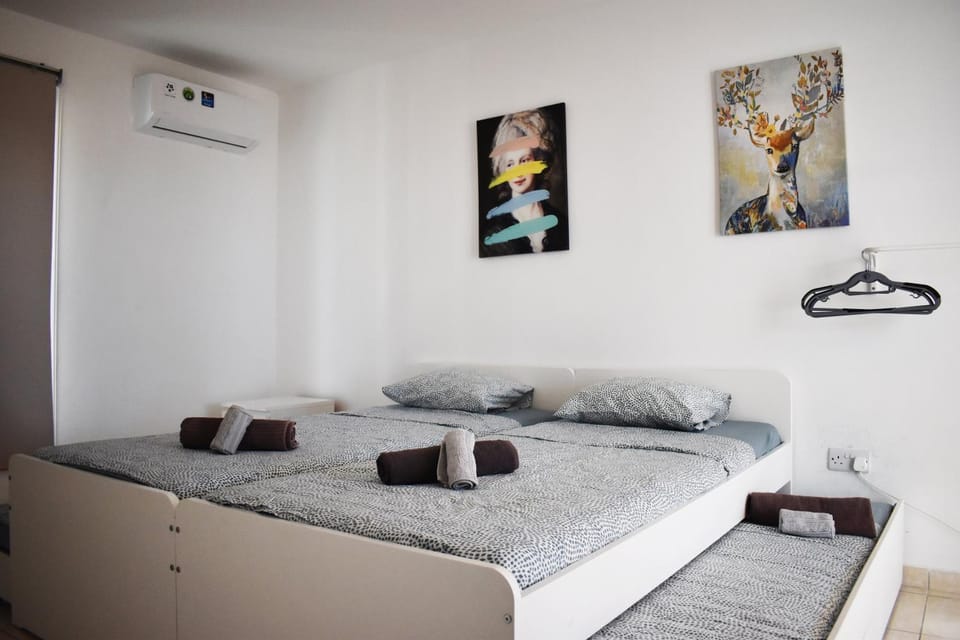 Bed, Photo of the whole room, Bedroom, towels, air conditioner