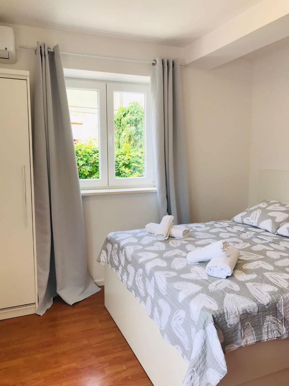 Bed, Bedroom, towels, wardrobe, air conditioner