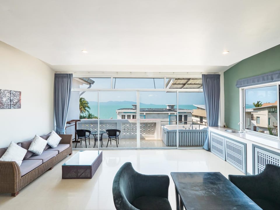 View (from property/room), Living room, Seating area, Dining area, Sea view
