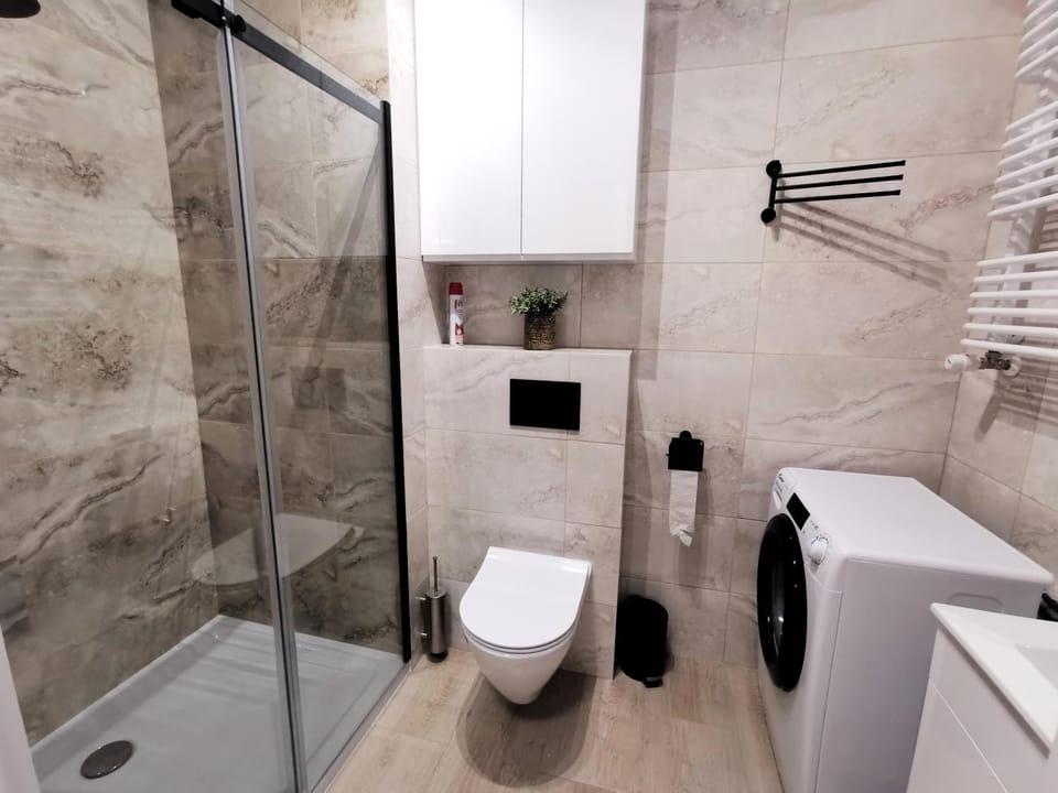 Shower, Toilet, Bathroom, towels, washing machine, dryer