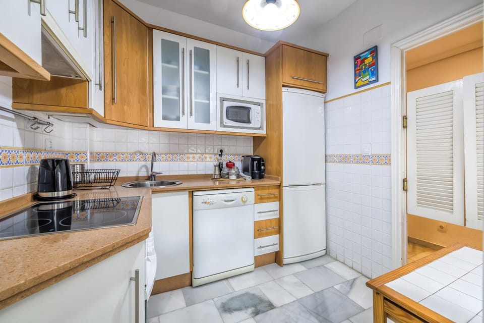 Kitchen or kitchenette, dishwasher, microwave, stove, toaster