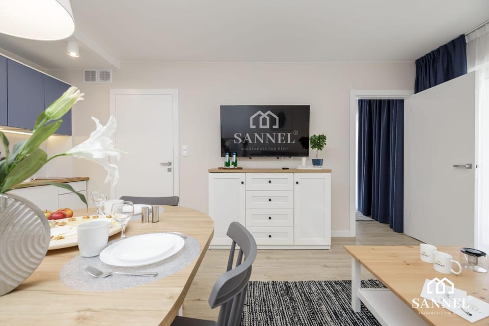 Property logo or sign, TV and multimedia, Kitchen or kitchenette, Living room, Decorative detail, Decorative detail, Seating area, Dining area, On site