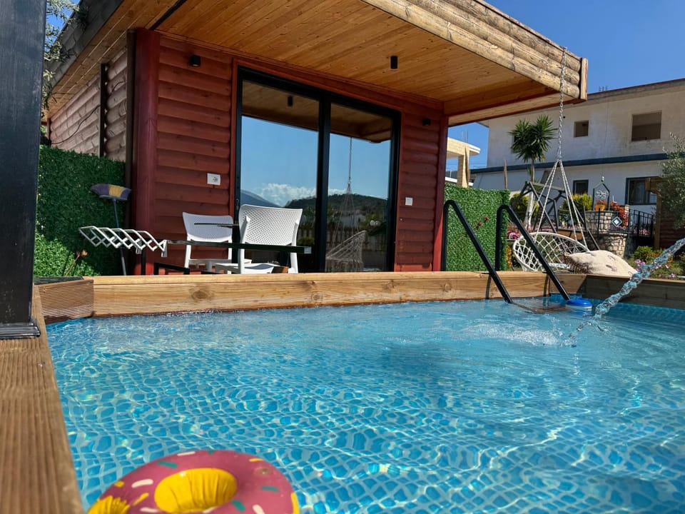 Property building, Patio, Day, Natural landscape, Bedroom, Pool view, Swimming pool, Swimming pool, sunbed, wardrobe