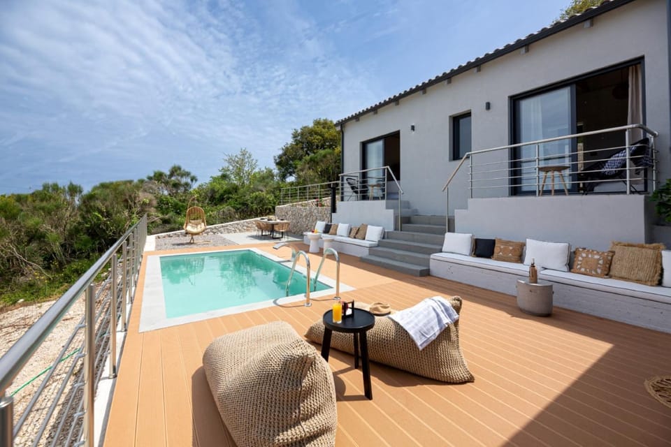 Property building, Day, Natural landscape, Balcony/Terrace, Living room, Seating area, Pool view, Swimming pool, sunbed