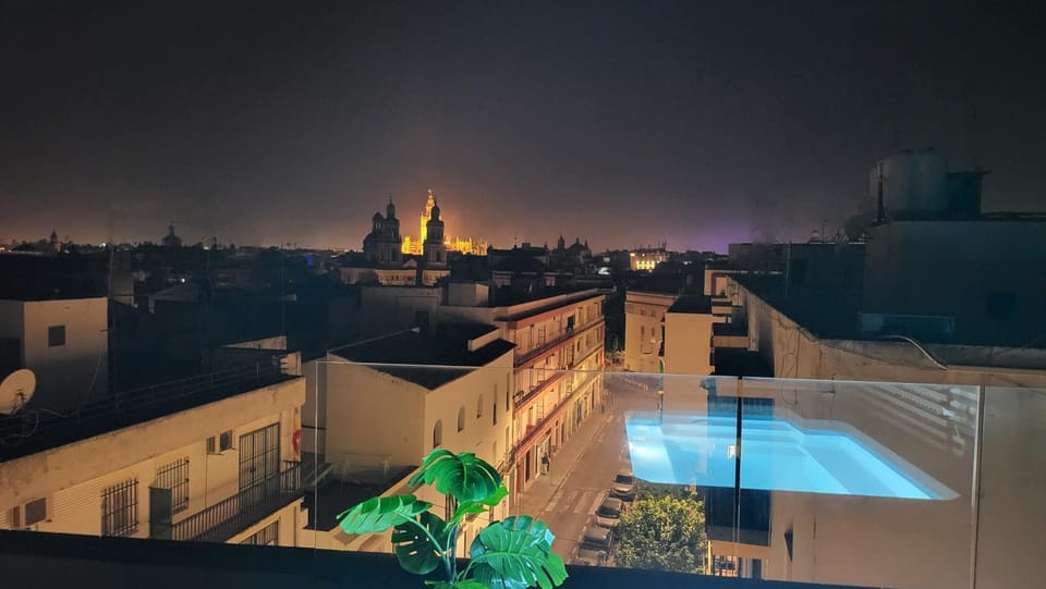 Night, View (from property/room), City view, Pool view, Swimming pool