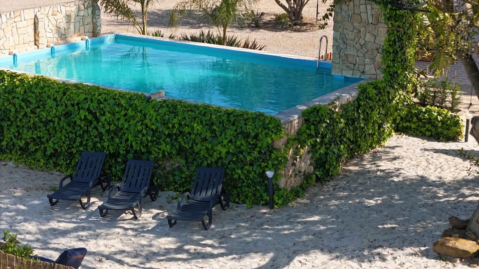 Property building, Living room, Swimming pool