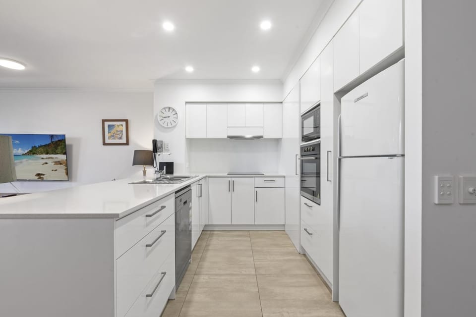 Kitchen or kitchenette, dishwasher, oven, stove