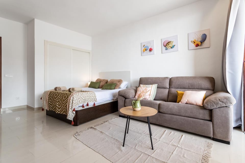 Bed, Living room, Seating area, Bedroom