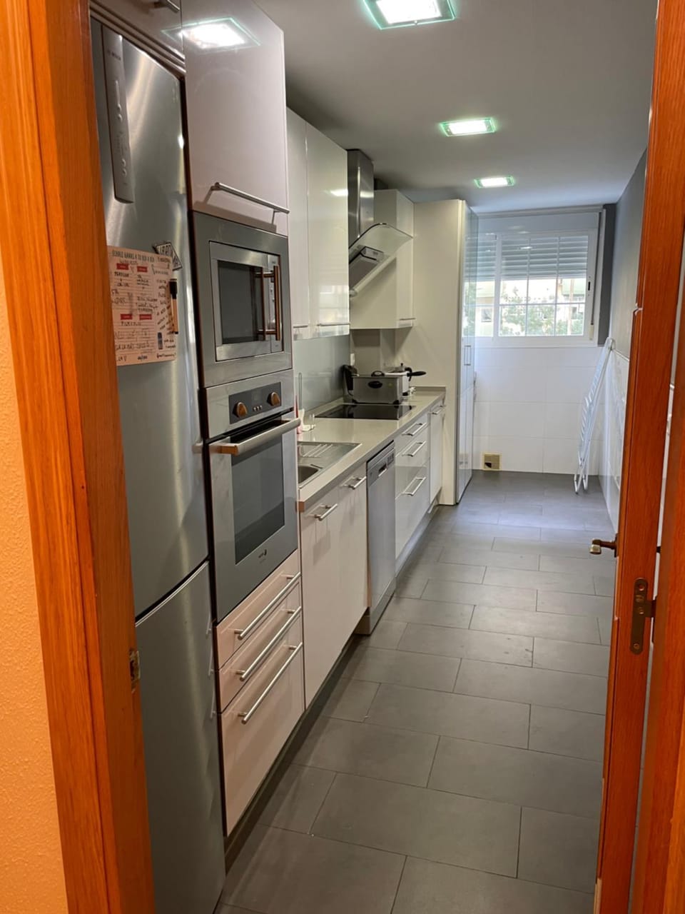 Kitchen or kitchenette, dishwasher, oven, stove