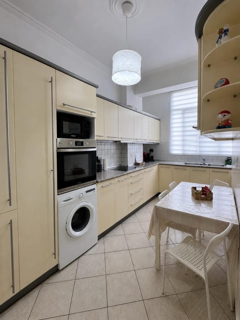 Kitchen or kitchenette, Dining area, oven, stove, toaster, washing machine