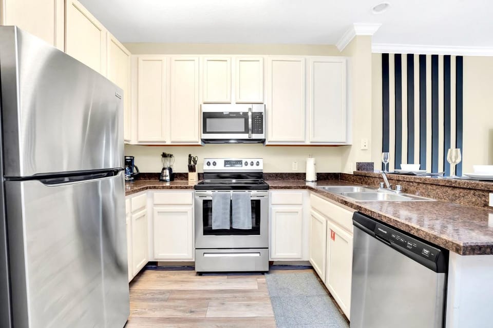 Kitchen or kitchenette, dishwasher, oven, stove, toaster