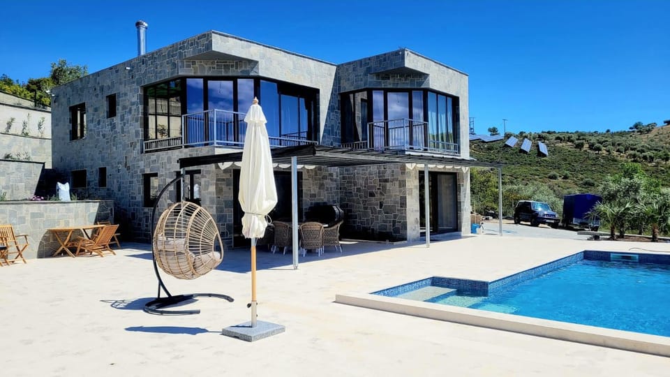 Property building, Patio, Pool view, Swimming pool, sunbed