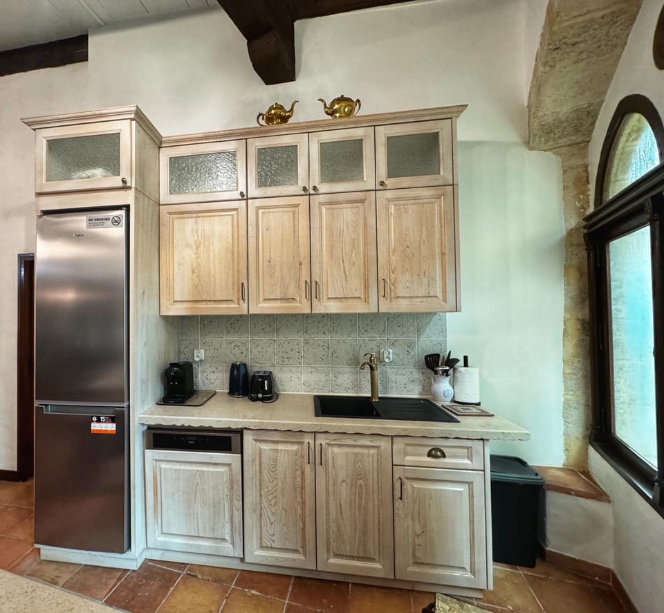 Kitchen or kitchenette, dishwasher, oven, stove