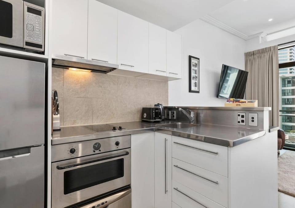 Kitchen or kitchenette, dishwasher, oven, stove, toaster