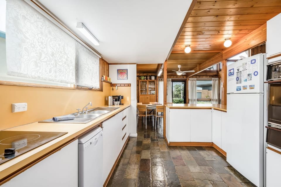 Kitchen or kitchenette, dishwasher, oven, stove