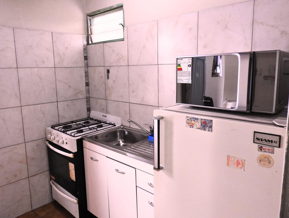 Kitchen or kitchenette, dishwasher, microwave, oven, stove, washing machine