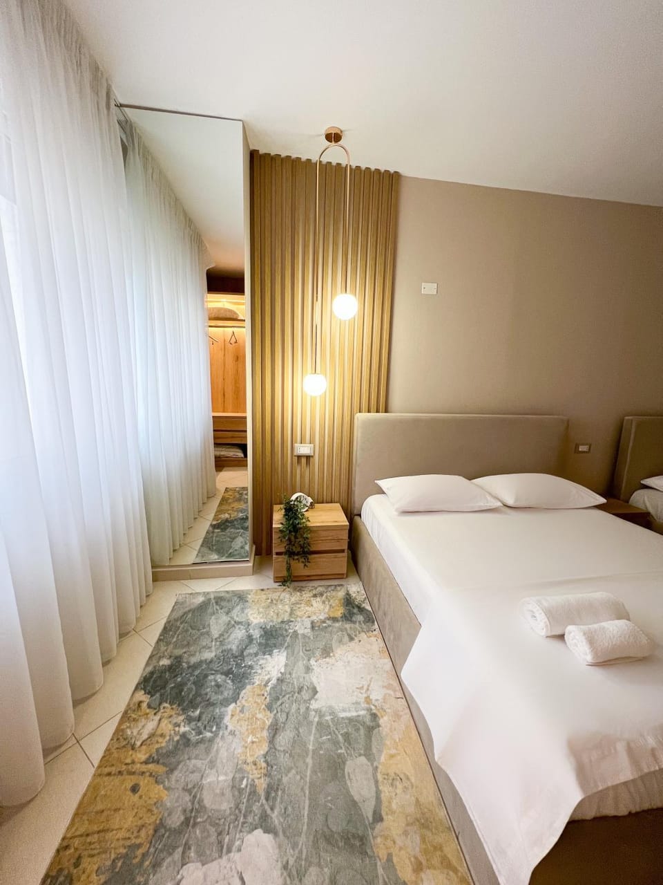 Bed, towels, wardrobe