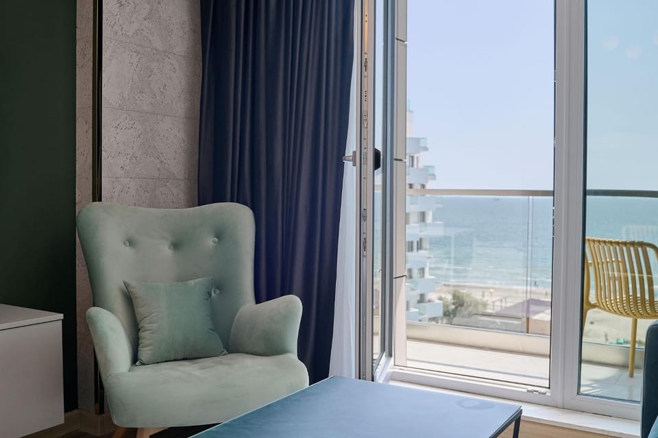 View (from property/room), Living room, Seating area, Sea view