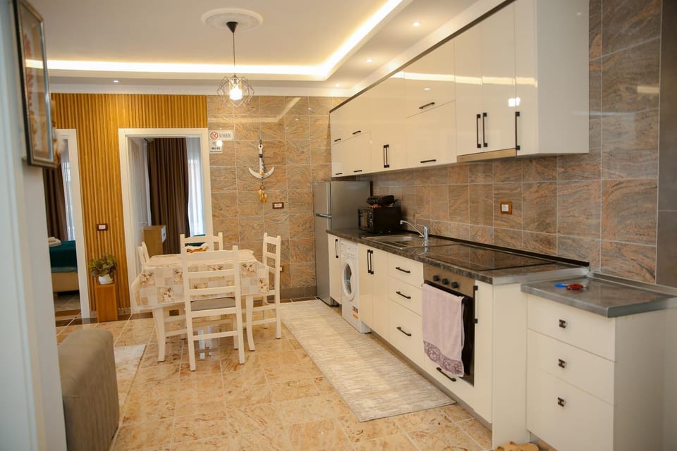 Kitchen or kitchenette, Dining area, dishwasher, minibar, oven, stove, kitchen