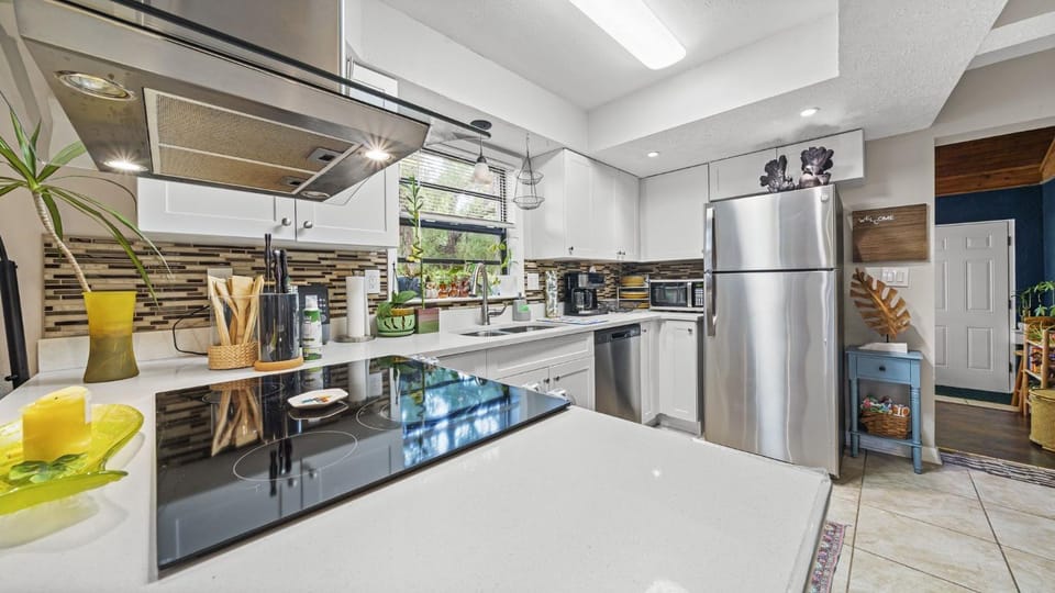 Kitchen or kitchenette, dishwasher, oven, stove