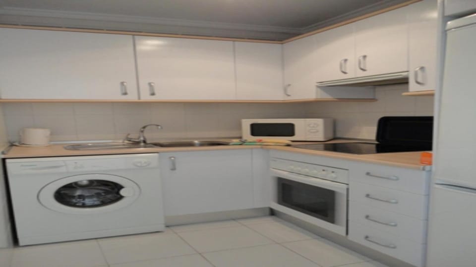 Kitchen or kitchenette, washing machine
