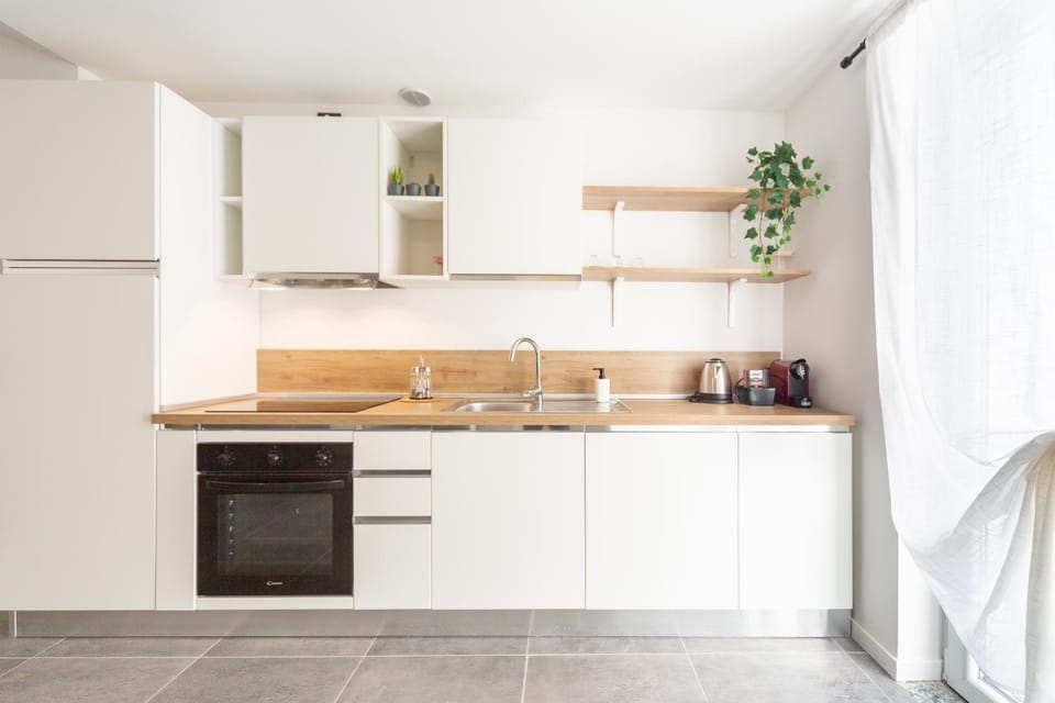 Kitchen or kitchenette, dishwasher, oven, stove