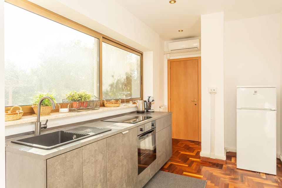 Kitchen or kitchenette, stove, air conditioner