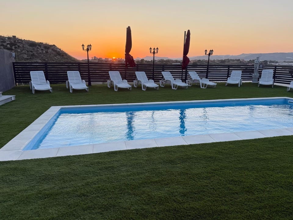 Property building, Living room, Swimming pool