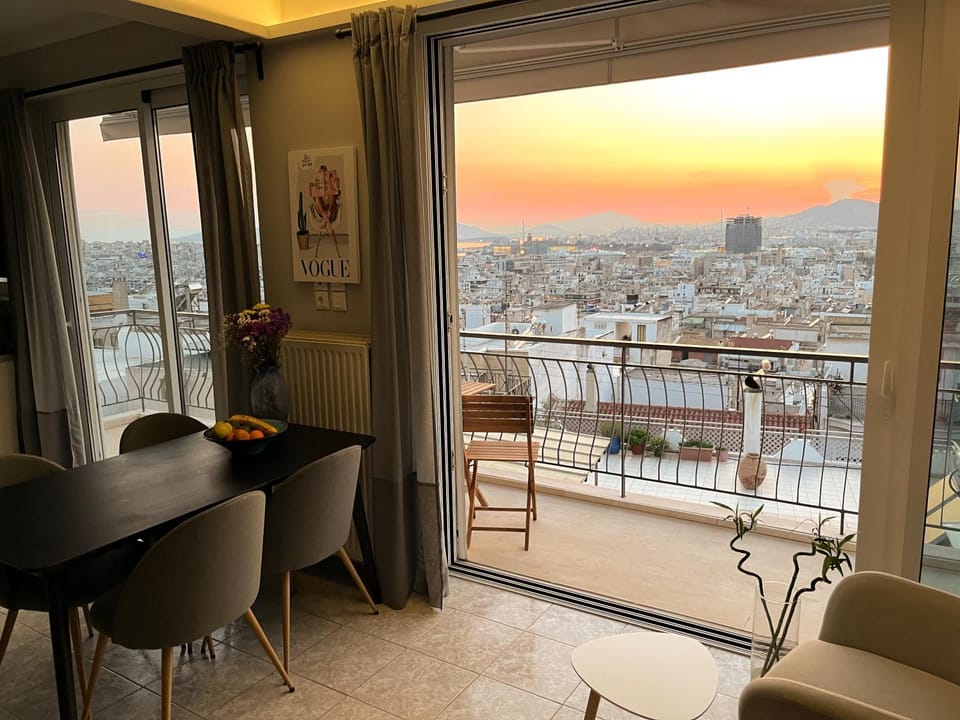 View (from property/room), Balcony/Terrace, Seating area, Dining area, City view, Sea view, Sunset