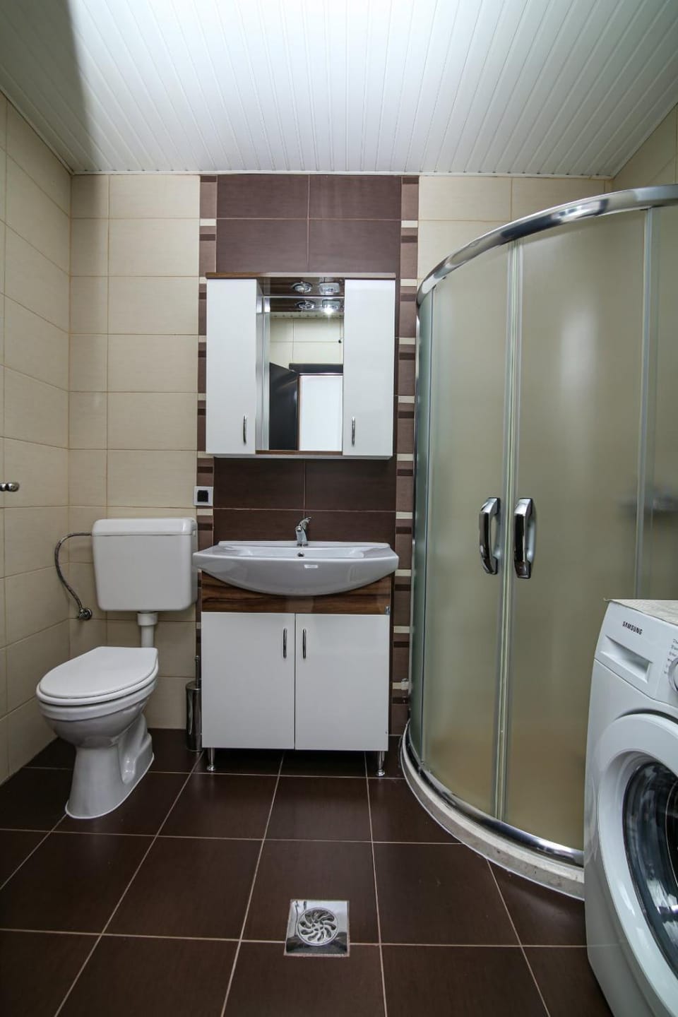 Shower, Toilet, Bathroom, towels, washing machine, dryer
