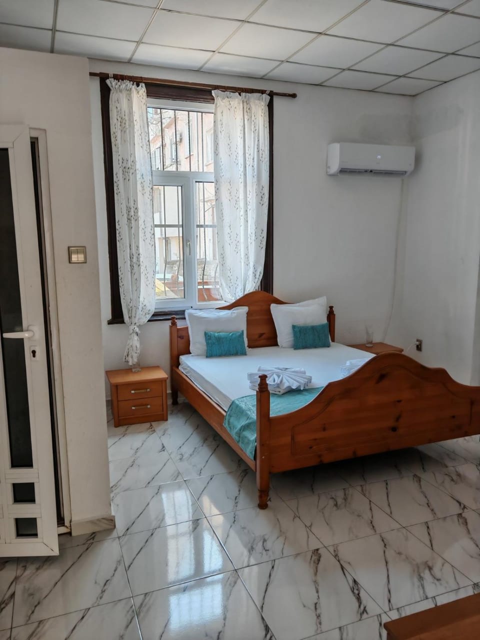 Photo of the whole room, Bedroom, towels, air conditioner
